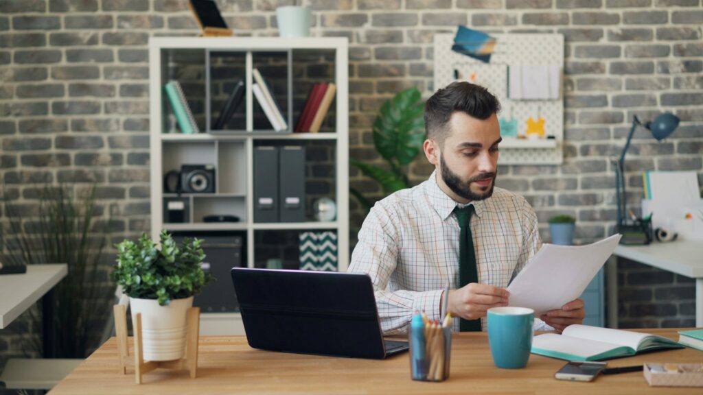 Business owner reviewing papers at a desk