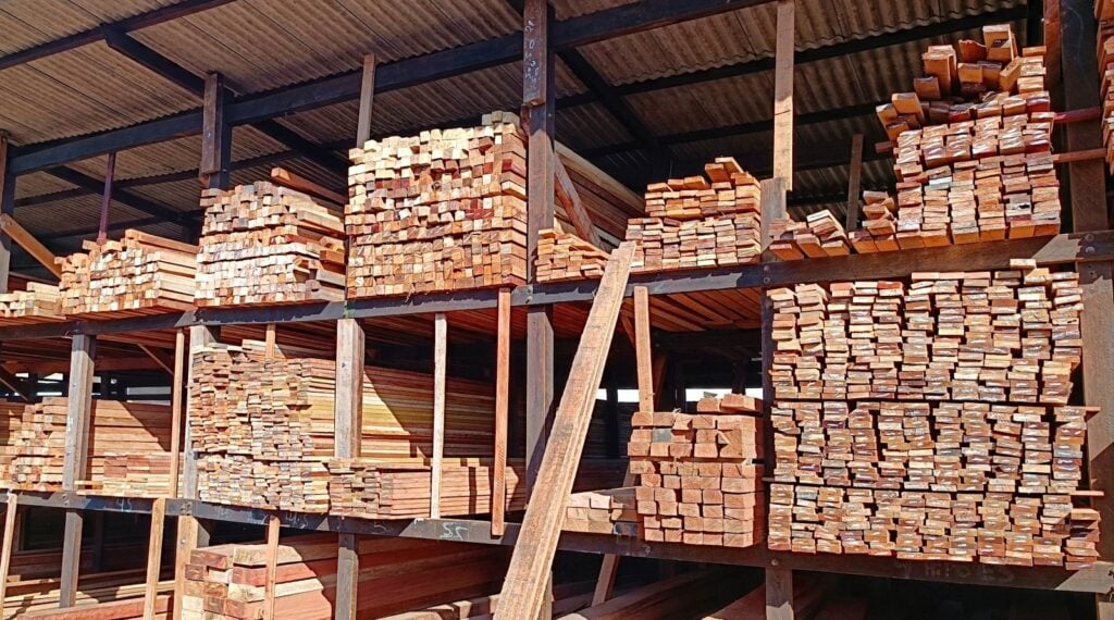 Lumber stacked on shelves at a building supply store